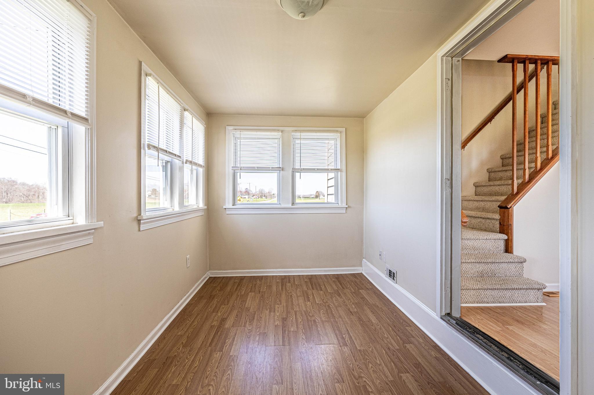 230 Landing Street Southampton, NJ 08088 - Photo 4 of 17 a view of a room with wooden floor and windows