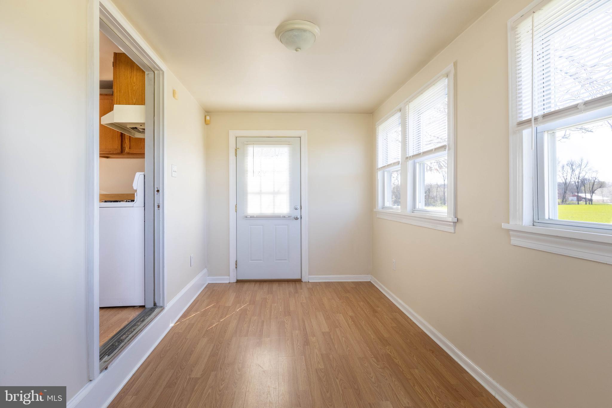 230 Landing Street Southampton, NJ 08088 - Photo 5 of 17 an empty room with wooden floor and windows