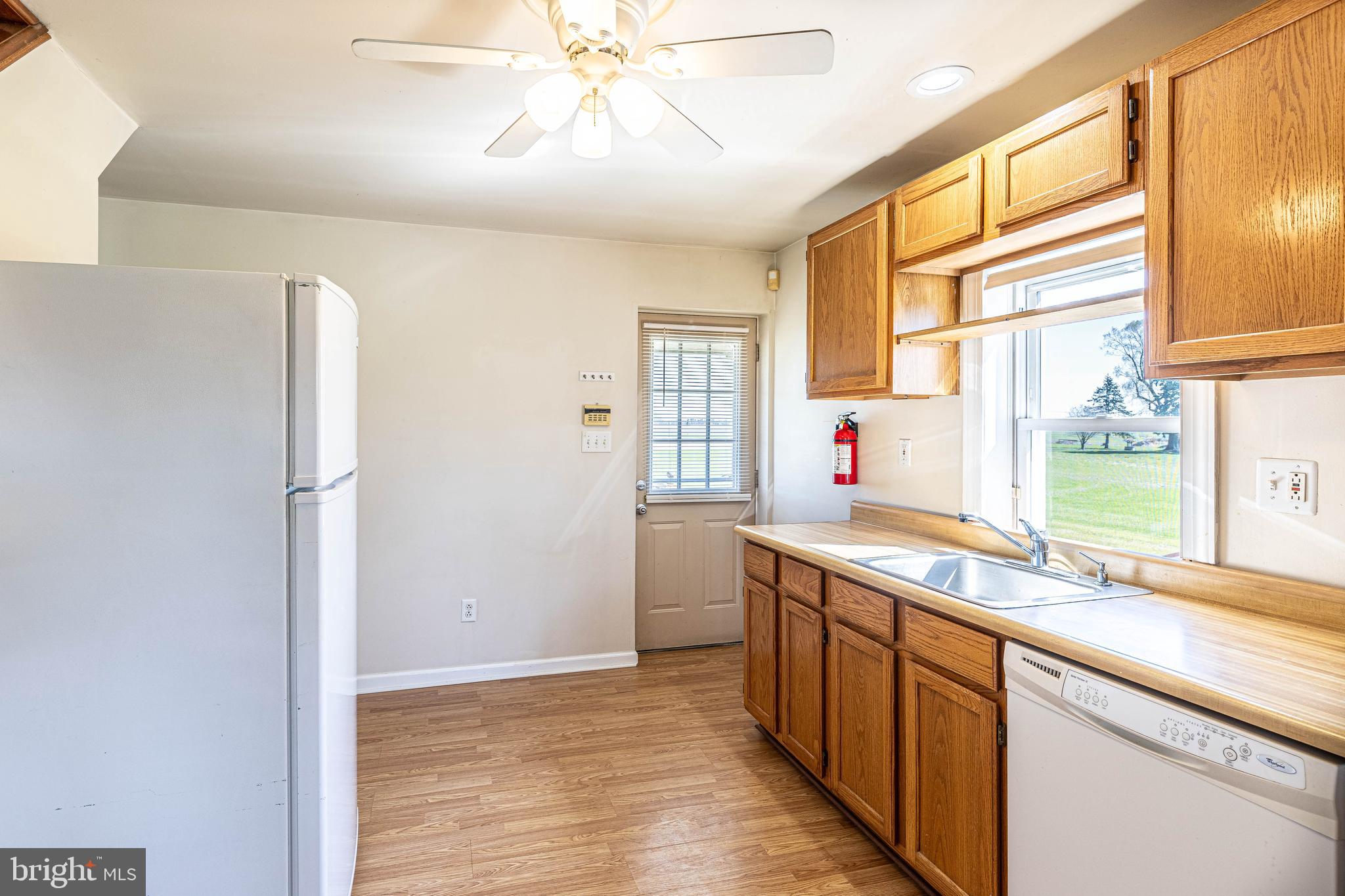 230 Landing Street Southampton, NJ 08088 - Photo 6 of 17 a kitchen with stainless steel appliances a sink and a refrigerator