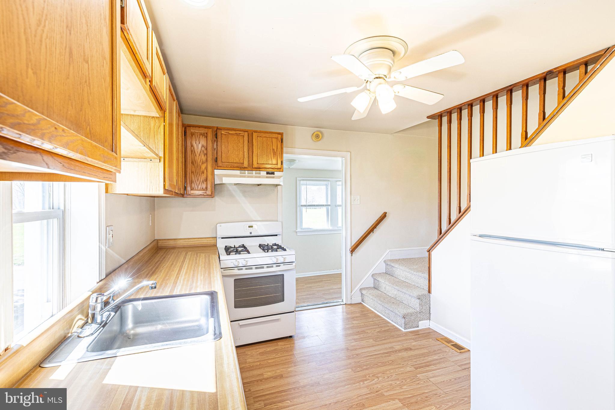 230 Landing Street Southampton, NJ 08088 - Photo 8 of 17 a kitchen with sink refrigerator and window