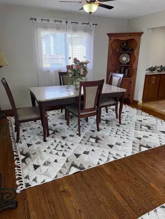 a view of a workspace and dining room