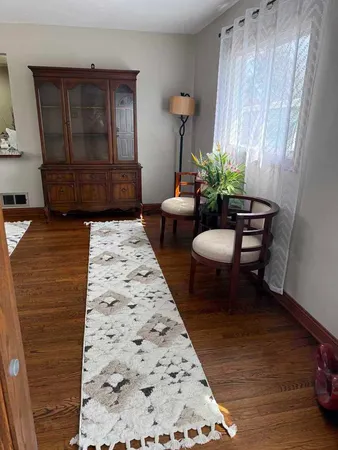 a living room with furniture and a rug