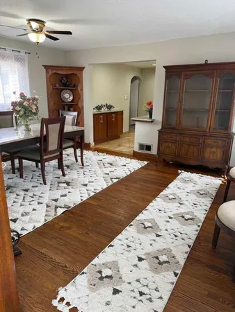 a living room with a couch and a dresser