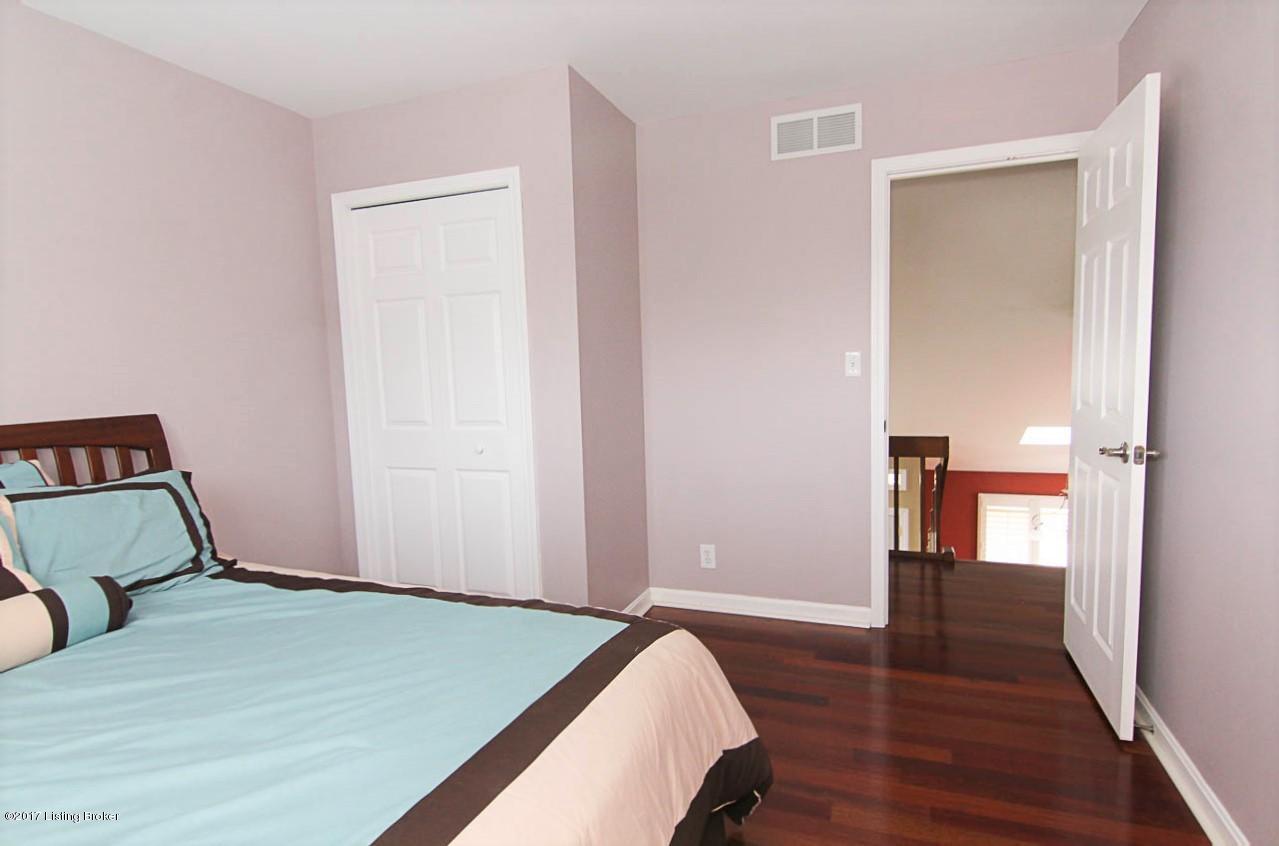 6602 Windhurst Road Louisville, KY 40207 - Photo 28 of 49 Large Bedroom with closet and Hardwood Floors.