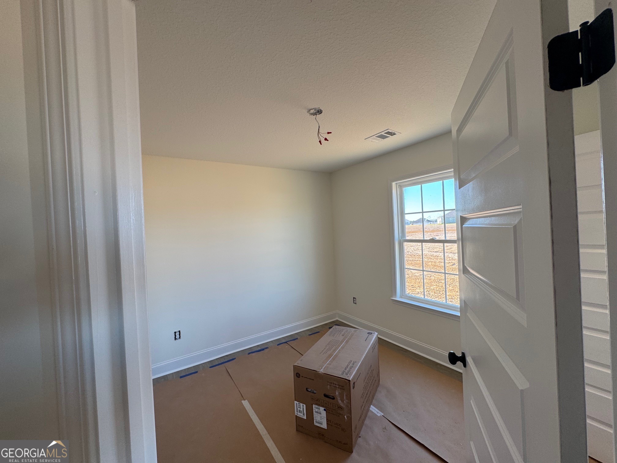 64 Pampas Road Statesboro, GA 30458 - Photo 11 of 13 a view of an empty room with a window