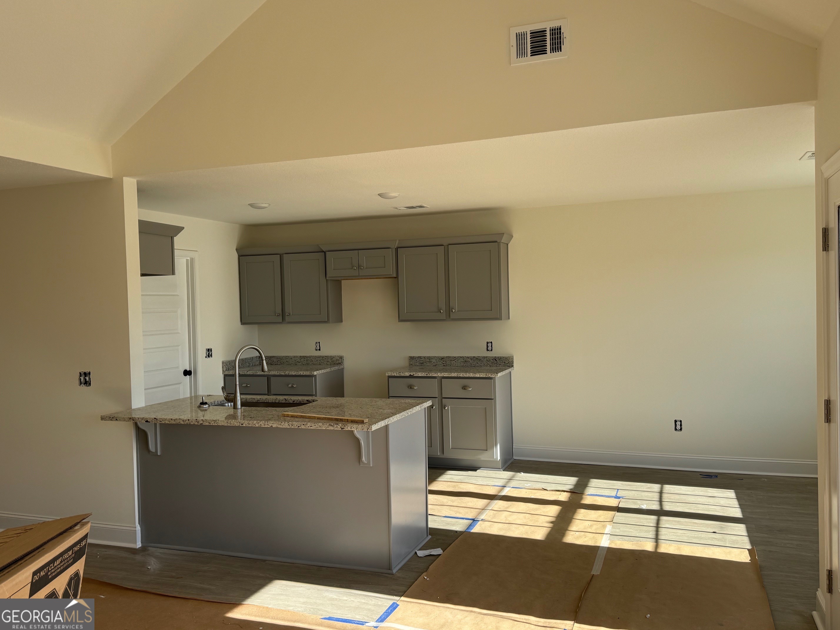 64 Pampas Road Statesboro, GA 30458 - Photo 3 of 13 a kitchen with stainless steel appliances a sink stove and cabinets