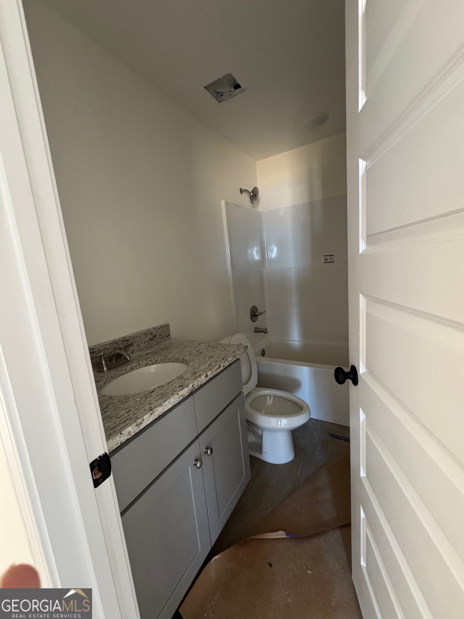 64 Pampas Road Statesboro, GA 30458 - Photo 9 of 13 a bathroom with a granite countertop sink toilet and shower