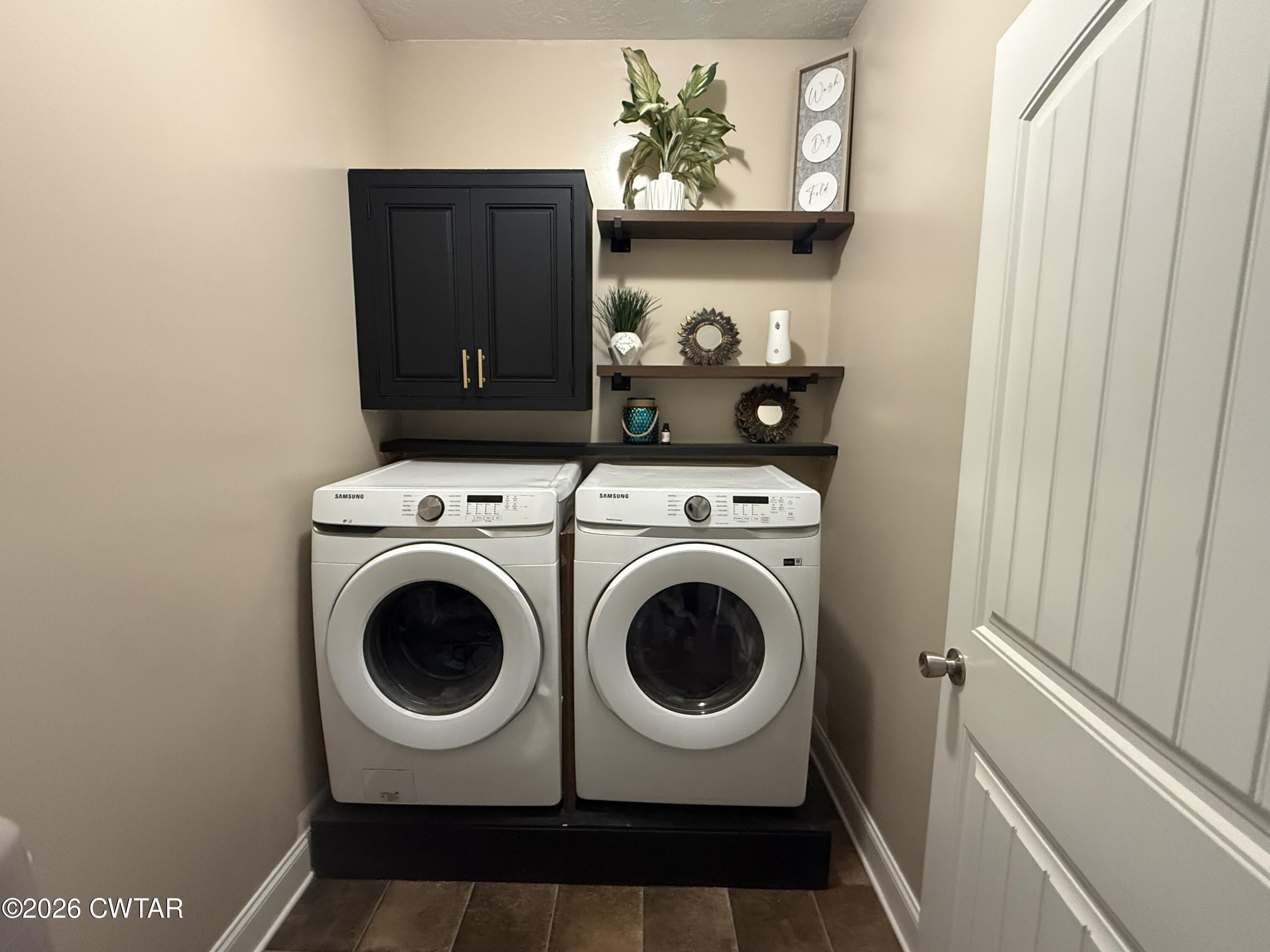 601 Locust Street Troy, TN 38260 - Photo 18 of 22 a utility room with dryer and washer