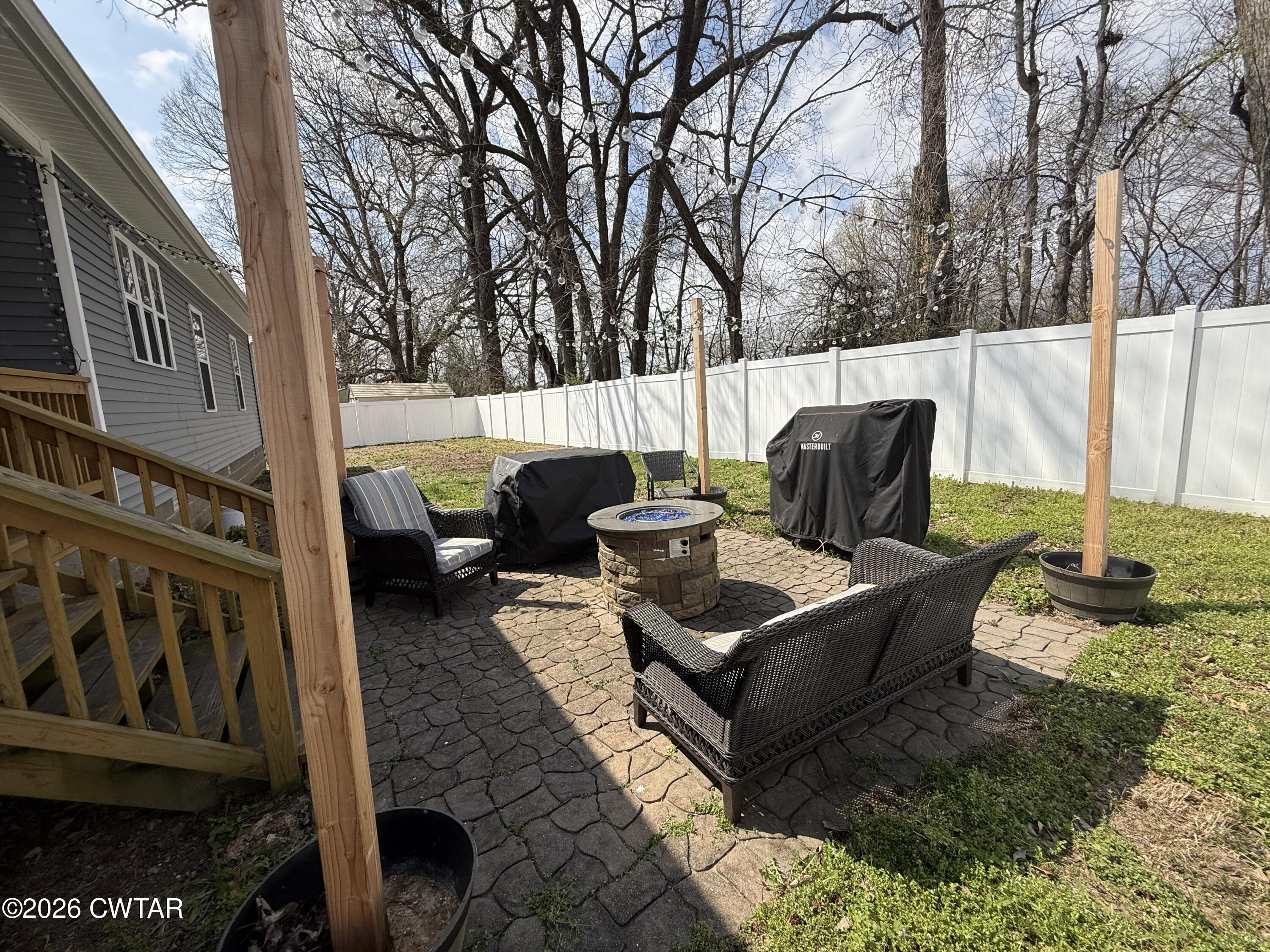 601 Locust Street Troy, TN 38260 - Photo 19 of 22 a view of a back yard with patio
