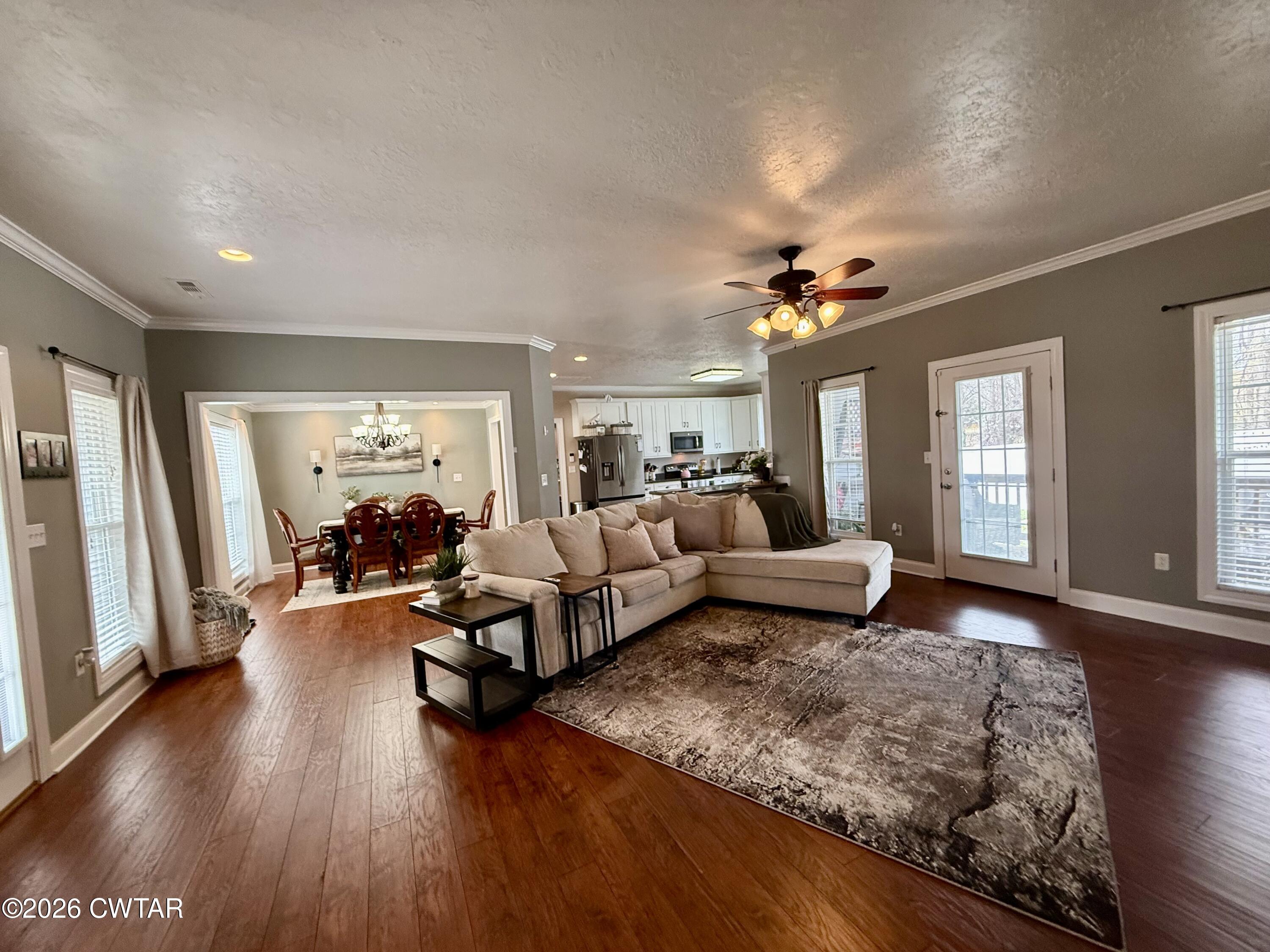 601 Locust Street Troy, TN 38260 - Photo 3 of 22 a living room with furniture and a wooden floor