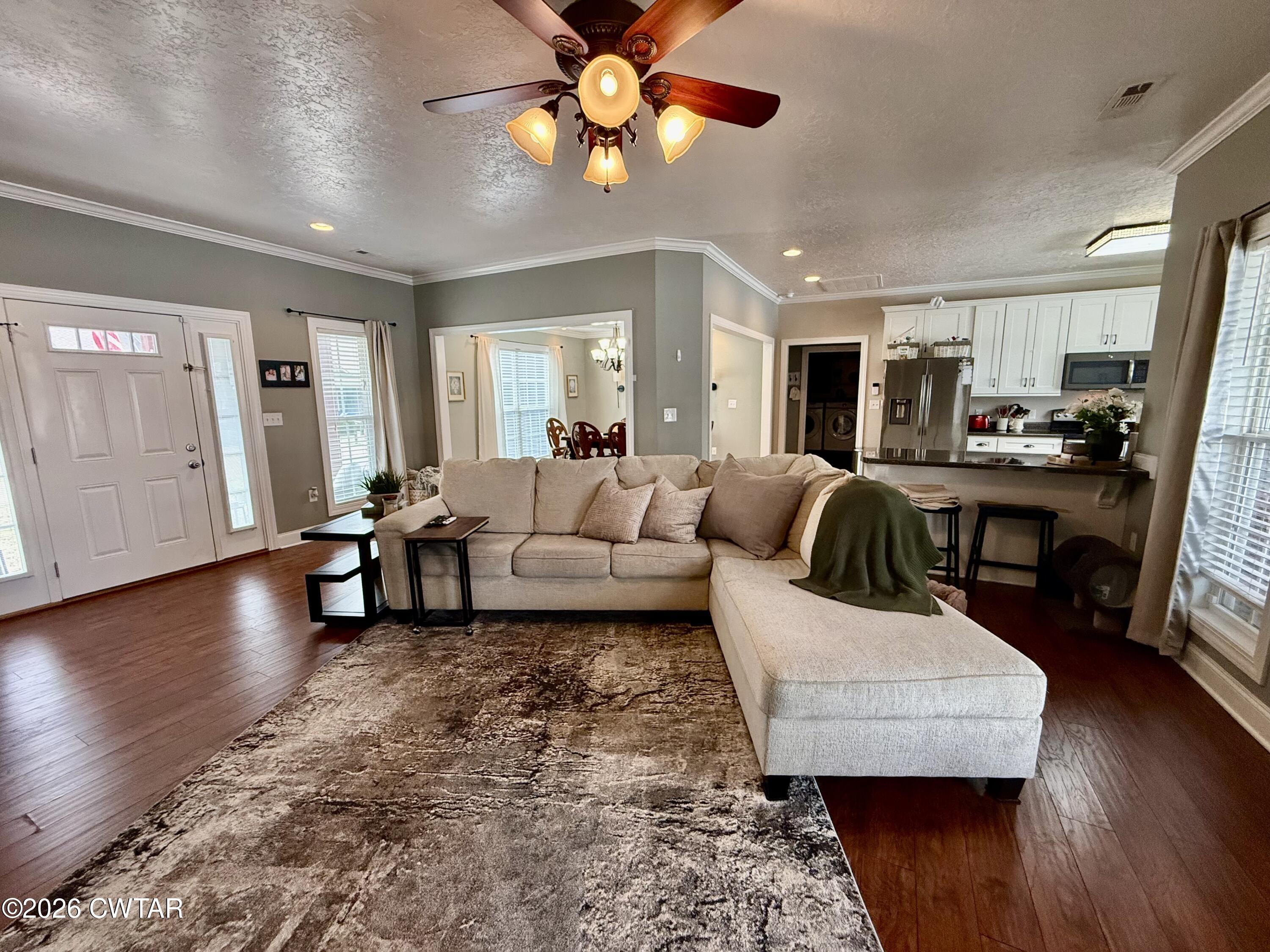 601 Locust Street Troy, TN 38260 - Photo 4 of 22 a living room with furniture and a wooden floor