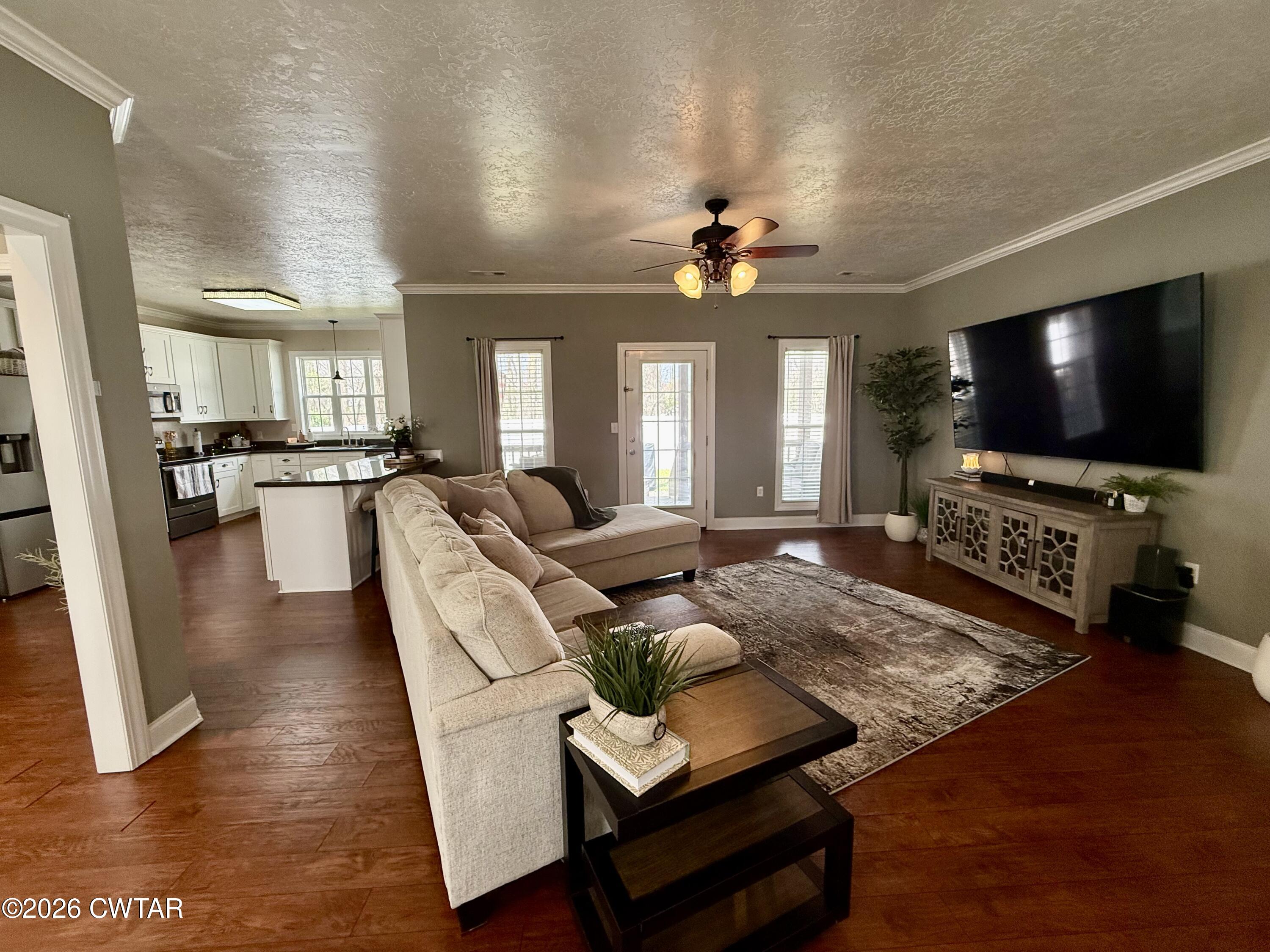 601 Locust Street Troy, TN 38260 - Photo 5 of 22 a living room with furniture and a flat screen tv