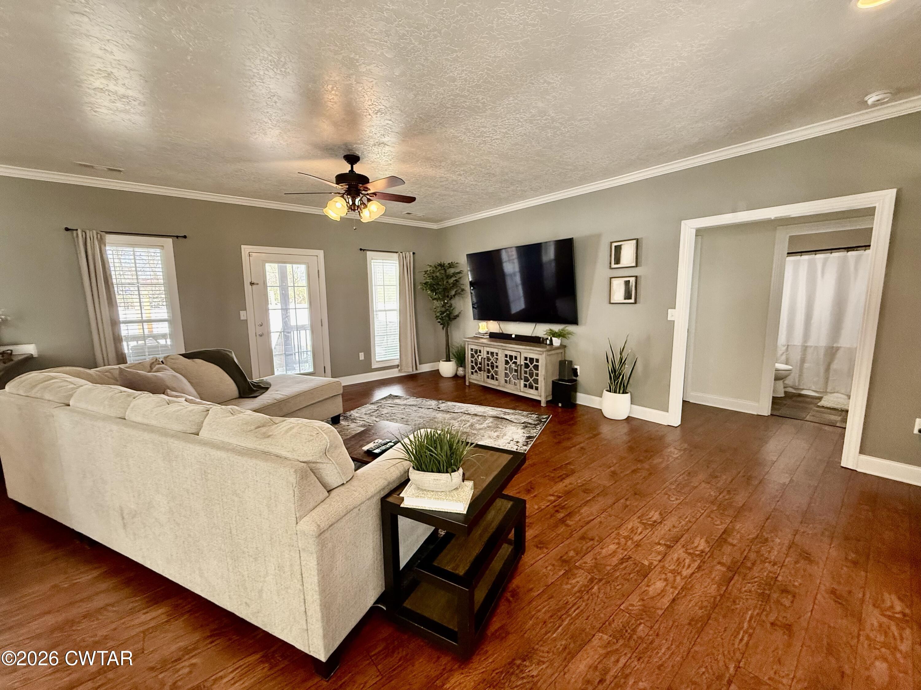 601 Locust Street Troy, TN 38260 - Photo 6 of 22 a living room with furniture and a flat screen tv