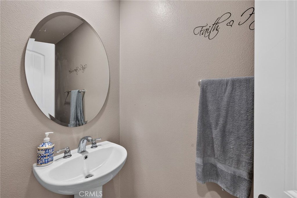 23347 Crystal Way Wildomar, CA 92595 - Photo 33 of 109 a bathroom with a sink and a mirror