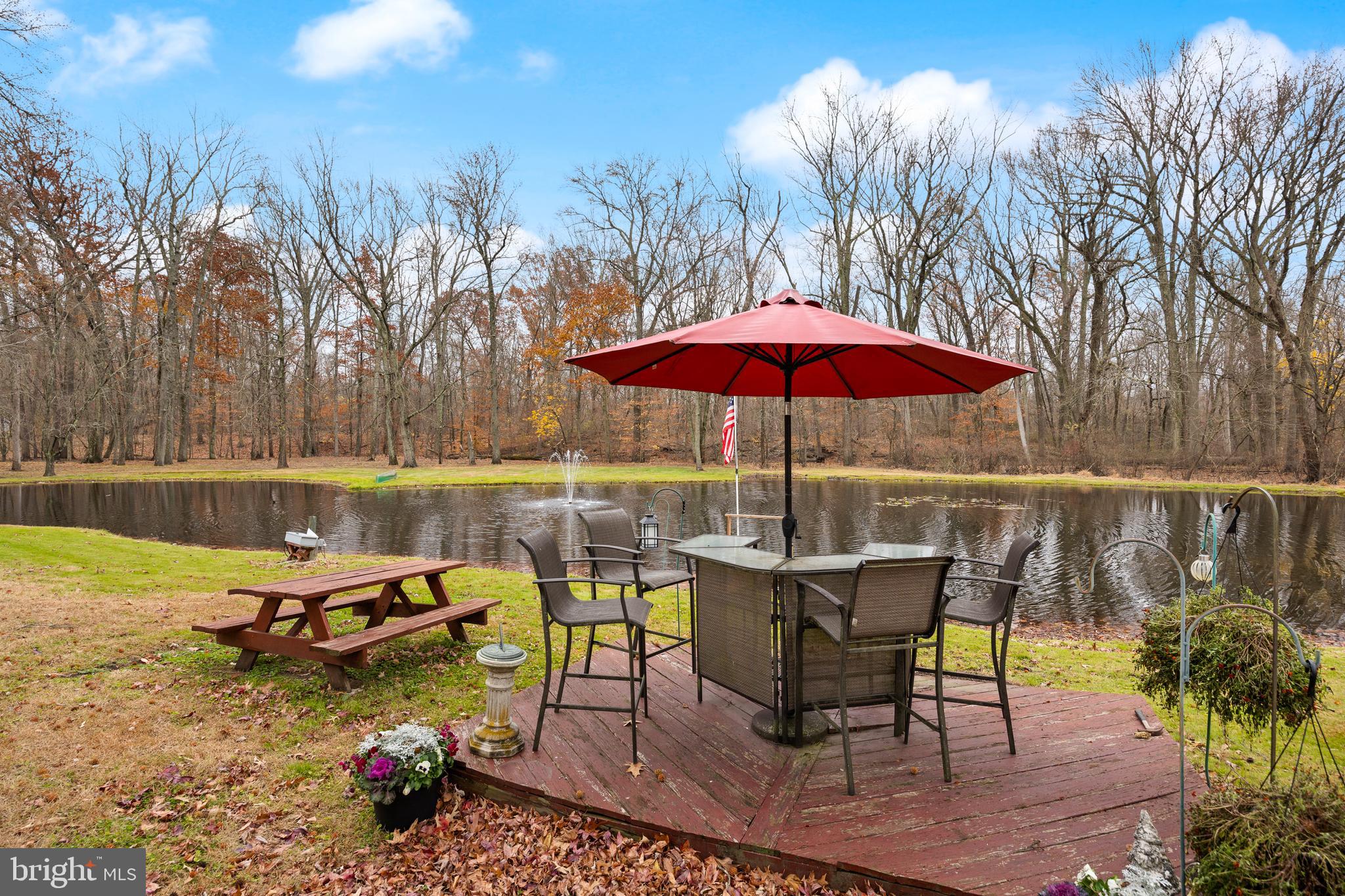 170 Birmingham Road Mount Holly, NJ 08060 - Photo 8 of 55 a view of a table and chairs under an umbrella