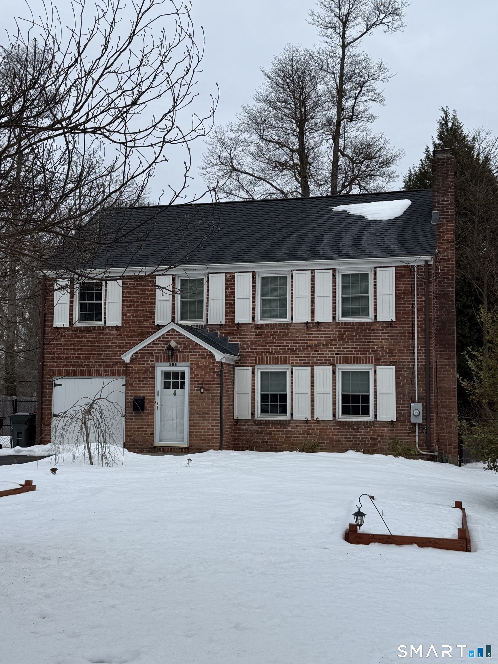 336 Ridgewood Road West Hartford, CT 06107 - Photo 1 of 21 a front view of a house with a yard