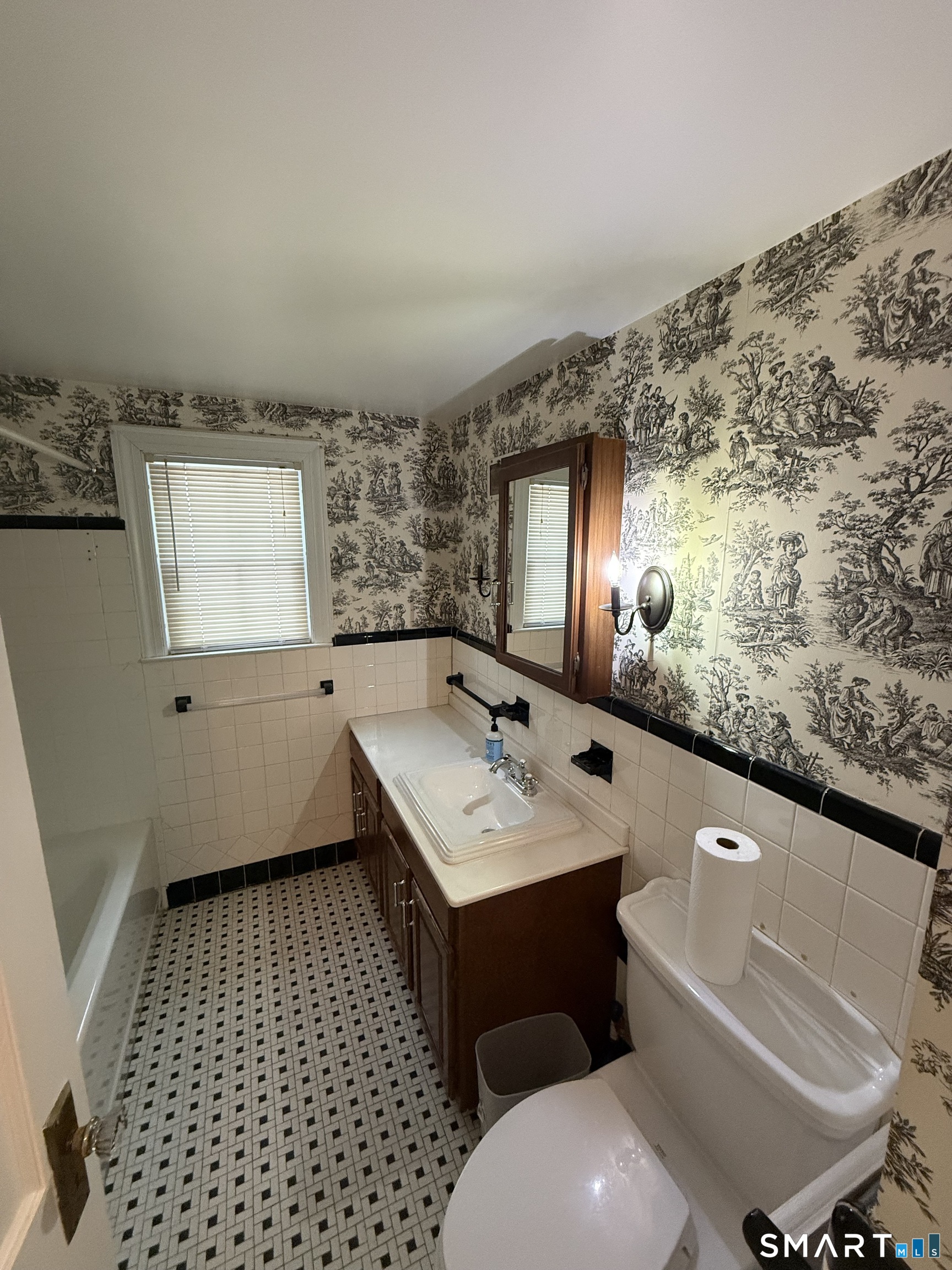 336 Ridgewood Road West Hartford, CT 06107 - Photo 12 of 21 a bathroom with a sink a toilet and mirror