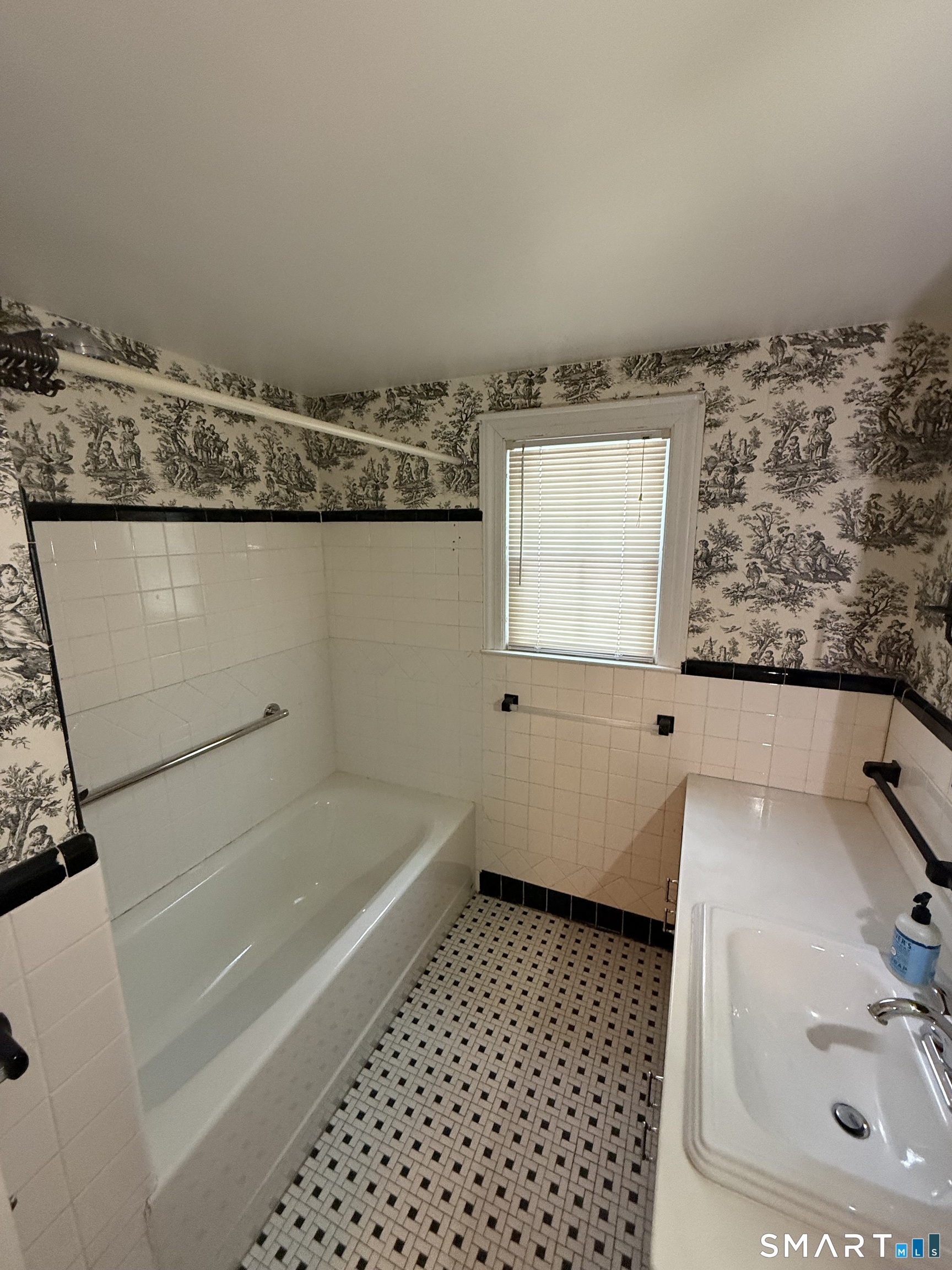 336 Ridgewood Road West Hartford, CT 06107 - Photo 13 of 21 a bathroom with a granite countertop sink a mirror and a bathtub