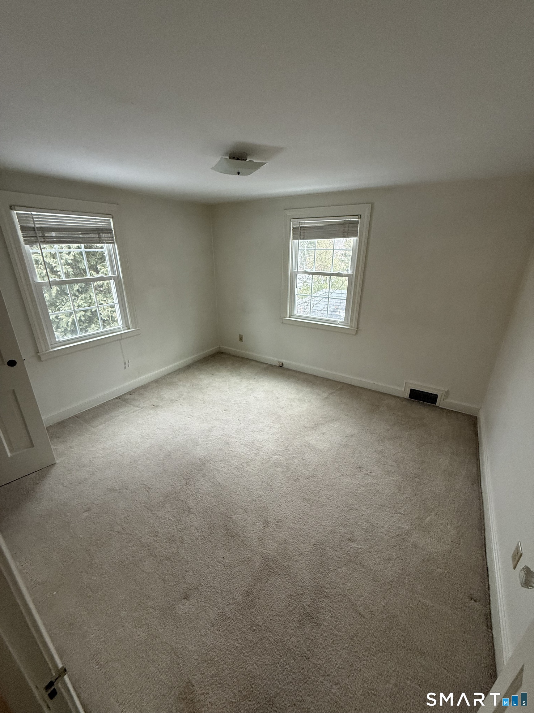 336 Ridgewood Road West Hartford, CT 06107 - Photo 15 of 21 an empty room with windows