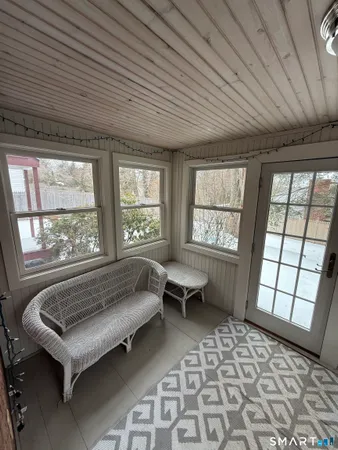 a living room with a couch and a window