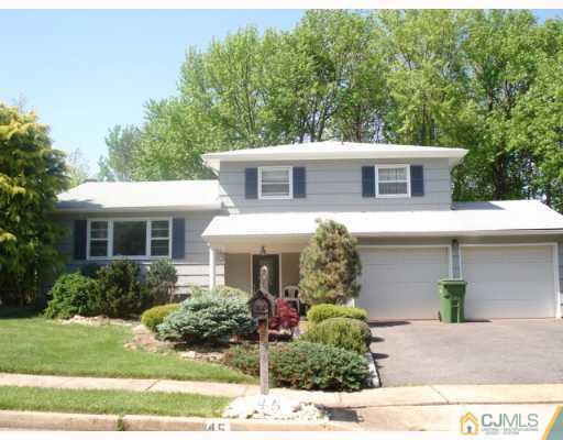 45 Lynnwood Road Edison, NJ 08820 - Photo 1 of 8 a front view of a house with garden