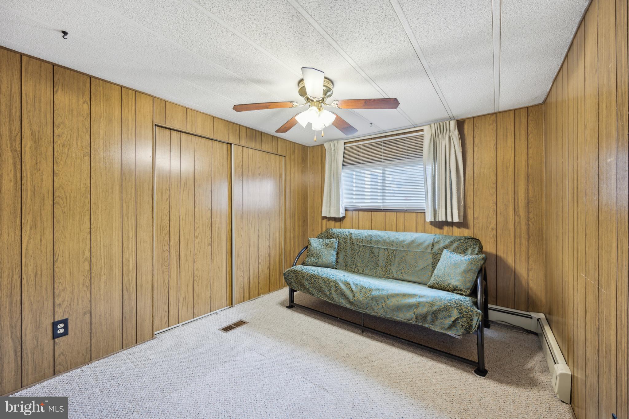 4140 Davis Drive Morrisville, PA 19067 - Photo 12 of 14 a living room with a couch and a chandelier
