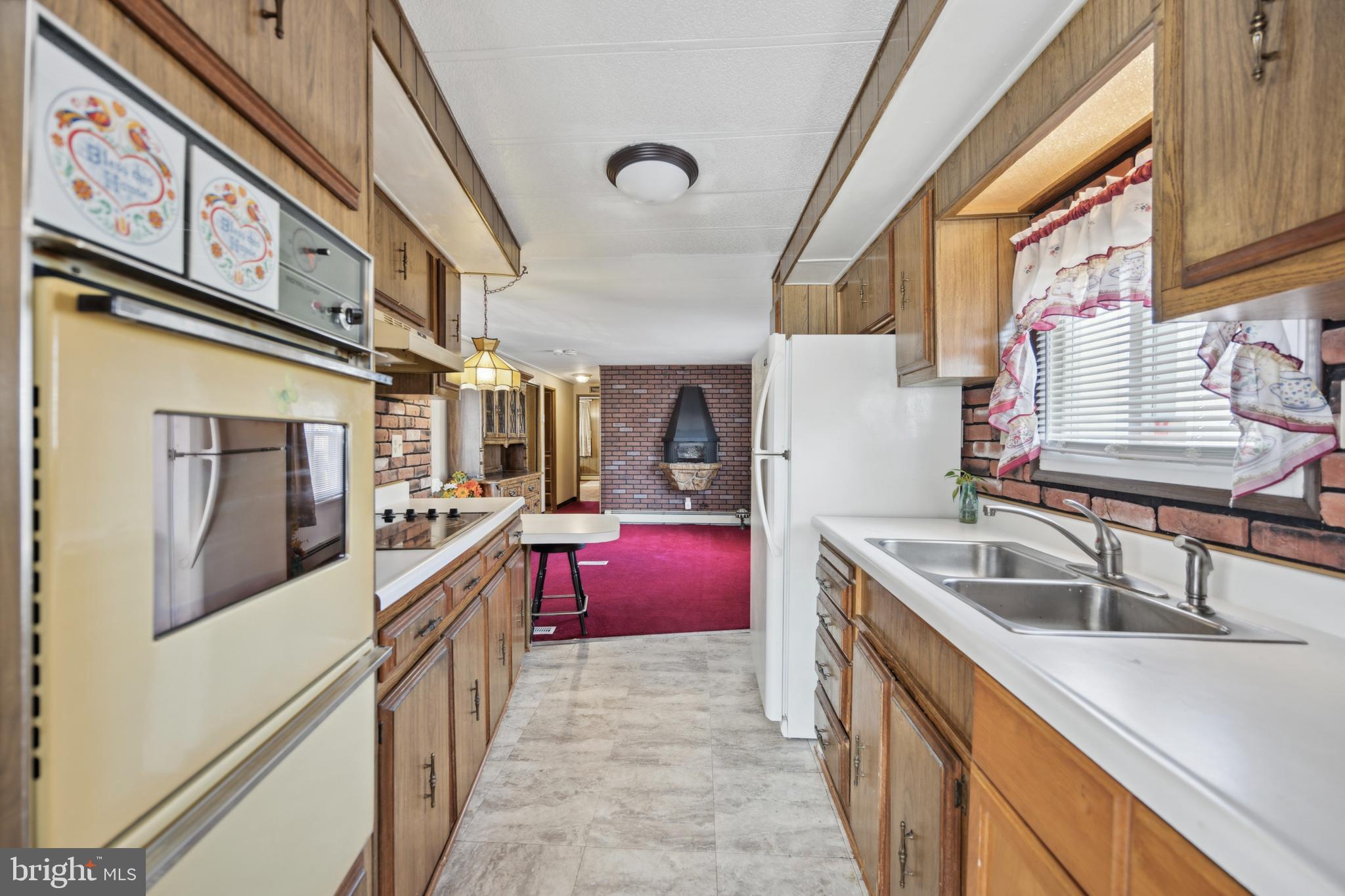 4140 Davis Drive Morrisville, PA 19067 - Photo 7 of 14 a kitchen with sink stove and cabinets