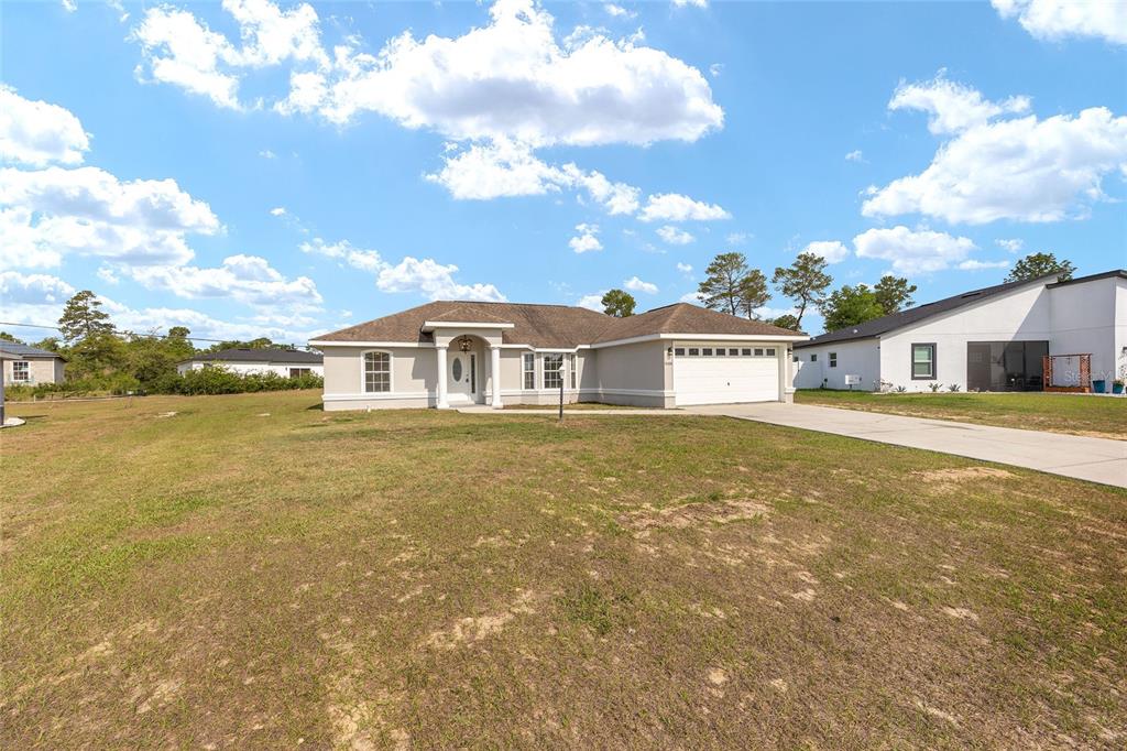 15434 Southwest 23rd Court Road Ocala, FL 34473 - Photo 3 of 41 a house with lake view