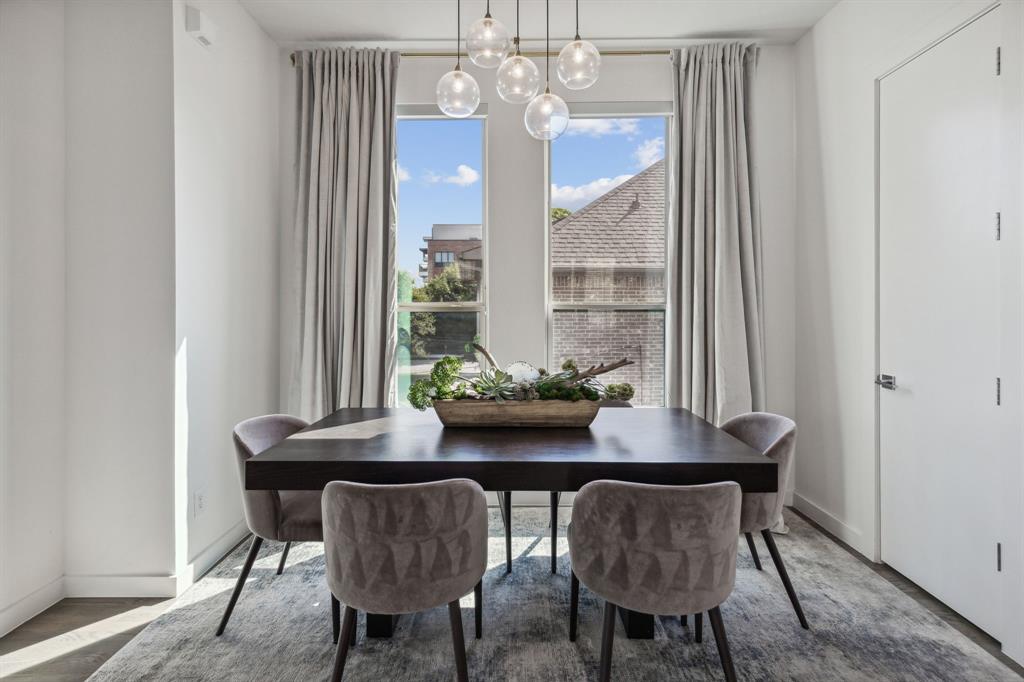 5015 Manett Street, Unit 101 Dallas, TX 75206 - Photo 11 of 25 a view of a dining room with furniture and window