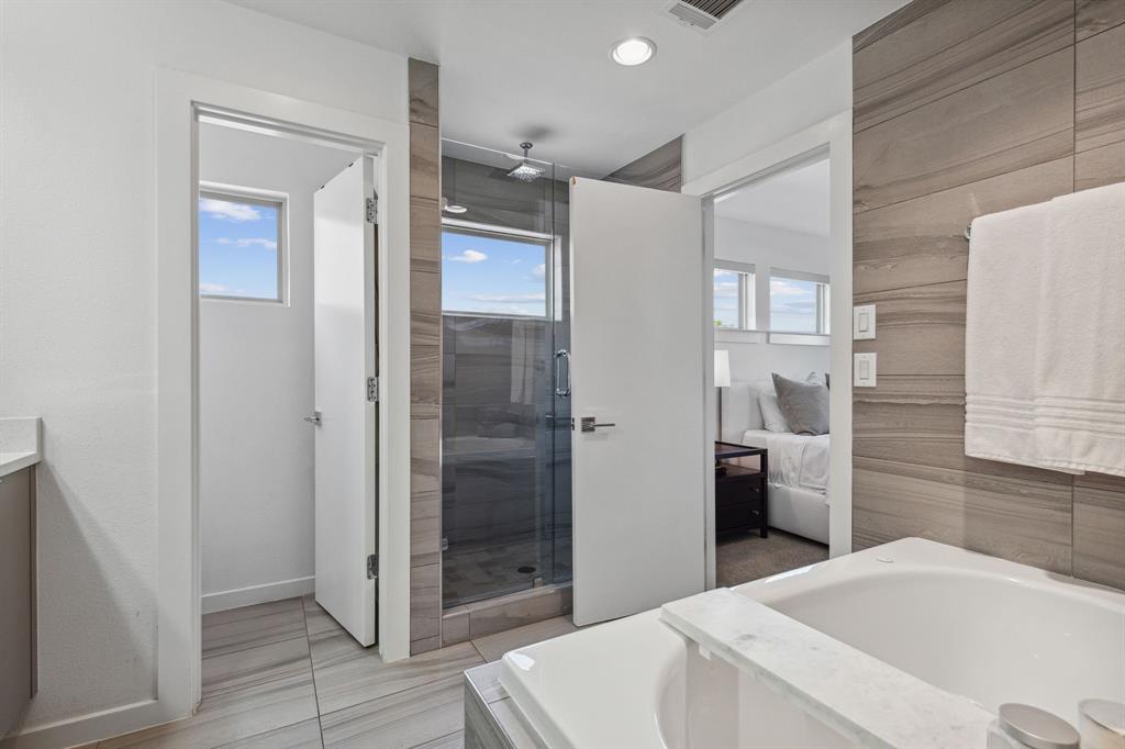 5015 Manett Street, Unit 101 Dallas, TX 75206 - Photo 21 of 25 a bathroom with a shower and a sink