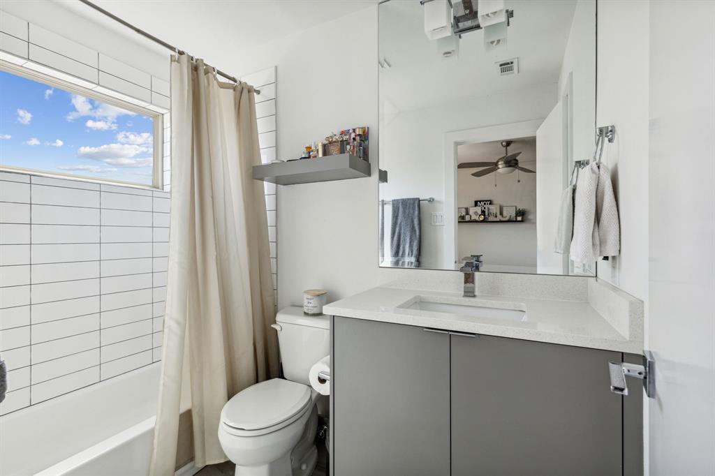 5015 Manett Street, Unit 101 Dallas, TX 75206 - Photo 24 of 25 a bathroom with a sink a toilet and shower