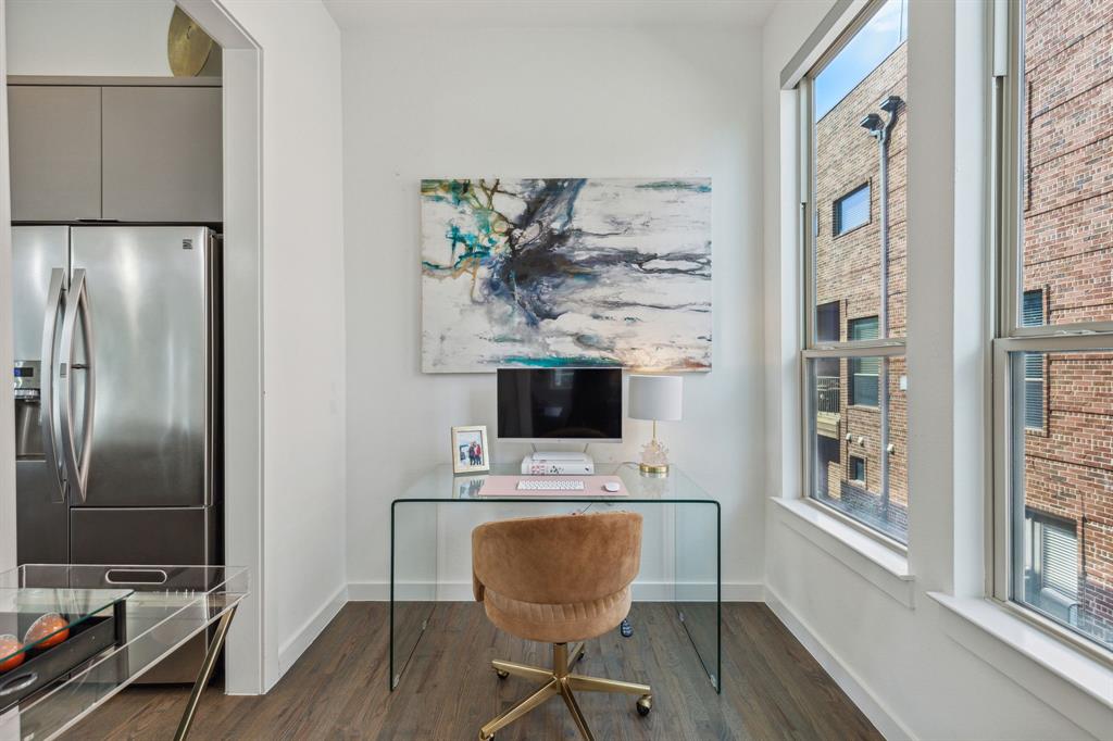 5015 Manett Street, Unit 101 Dallas, TX 75206 - Photo 9 of 25 a workspace with furniture and wooden floor