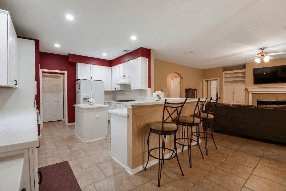 20423 Forest Drive Spring, TX 77388 - Photo 17 of 49 a kitchen with stainless steel appliances kitchen island granite countertop a sink and cabinets