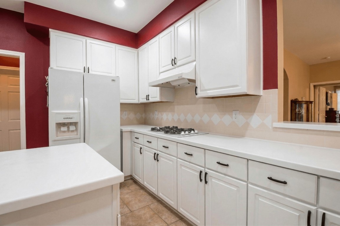 20423 Forest Drive Spring, TX 77388 - Photo 19 of 49 a kitchen with cabinets and appliances
