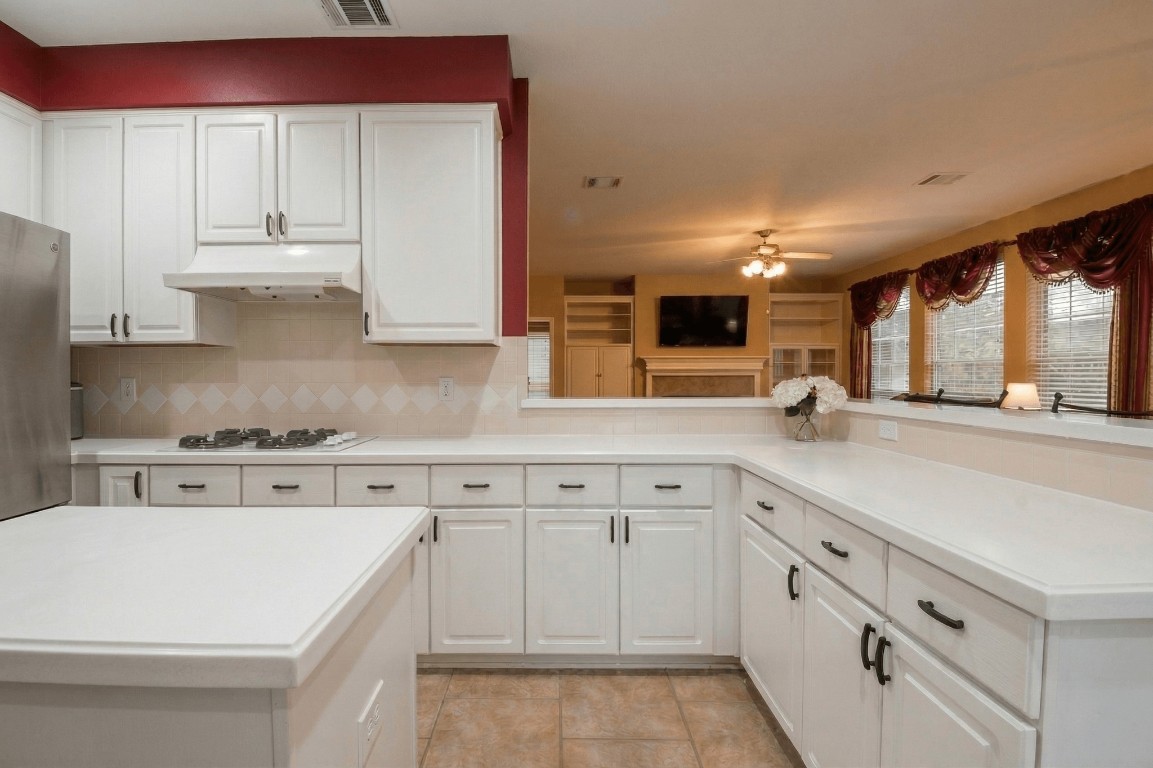 20423 Forest Drive Spring, TX 77388 - Photo 21 of 49 a kitchen with stainless steel appliances granite countertop a sink and cabinets