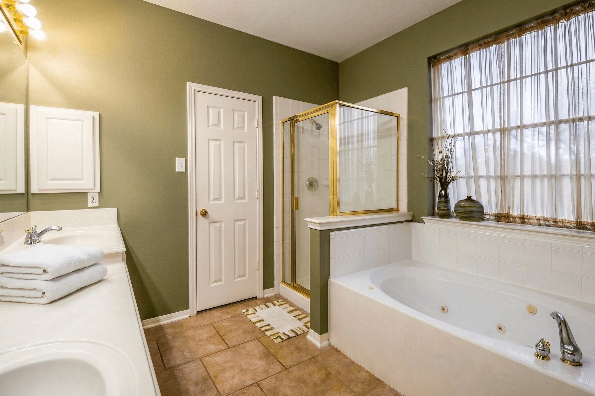 20423 Forest Drive Spring, TX 77388 - Photo 28 of 49 The primary bath features a jetted tub, separate shower, two closets and a water closet.