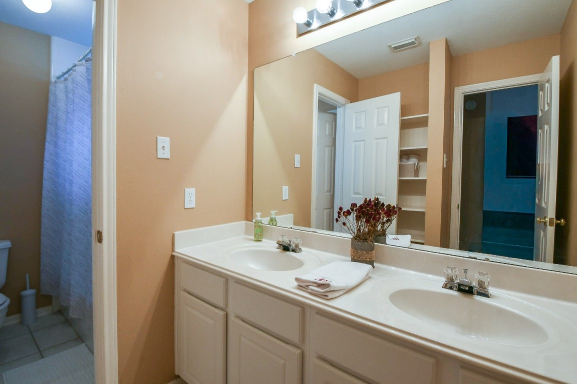 20423 Forest Drive Spring, TX 77388 - Photo 33 of 49 a bathroom with a sink and a mirror