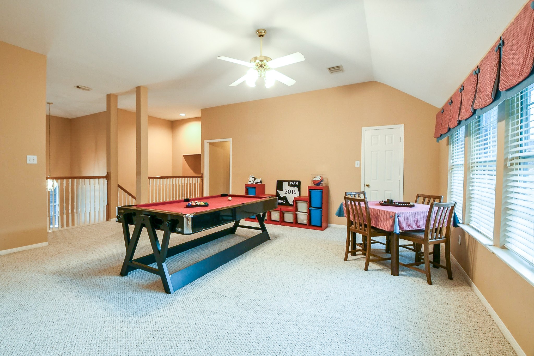 20423 Forest Drive Spring, TX 77388 - Photo 36 of 49 This spacious, well-lit game room features space enough for a pool table and a cozy seating area, perfect for entertaining. Large windows provide ample natural light, and the neutral carpet complements the open layout. There is a large closet that can be used to hold all the extra games or toys to keep the space clean and tidy.