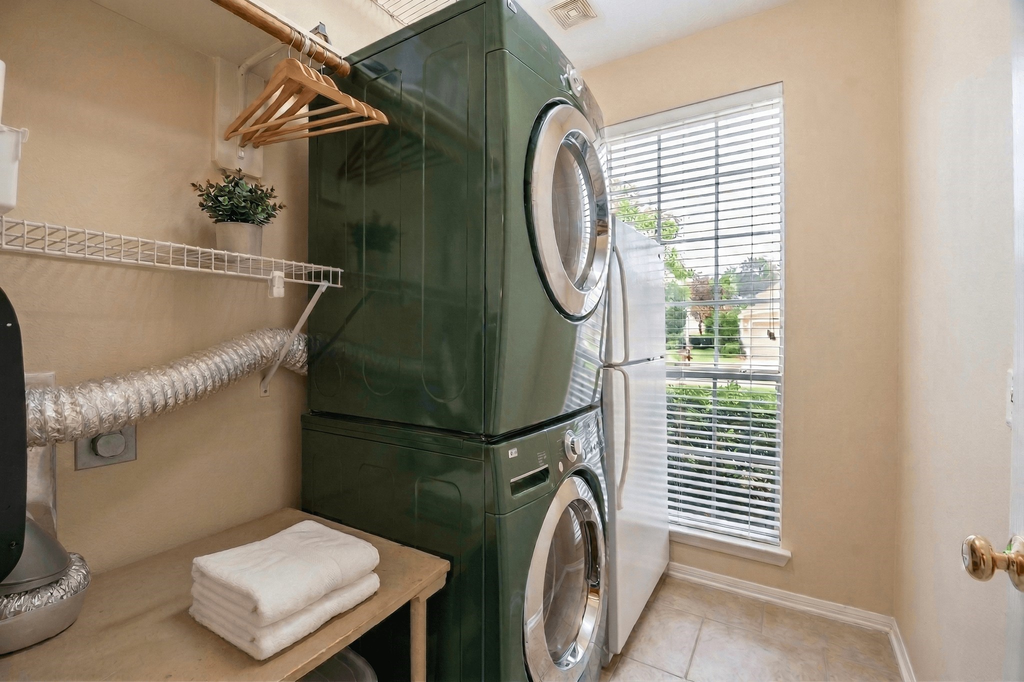 20423 Forest Drive Spring, TX 77388 - Photo 39 of 49 The laundry room is located just off of the kitchen and has space enough for an extra refrigerator and a folding table.