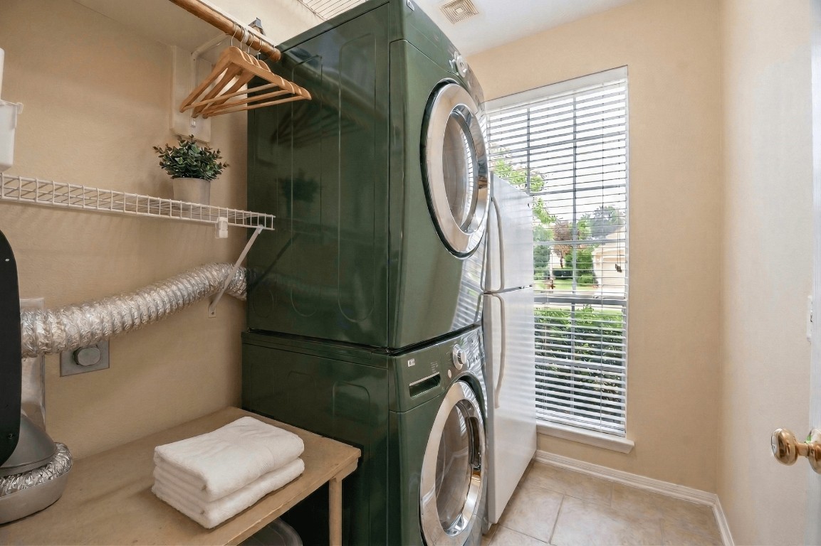 20423 Forest Drive Spring, TX 77388 - Photo 39 of 49 The laundry room is located just off of the kitchen and has space enough for an extra refrigerator and a folding table.