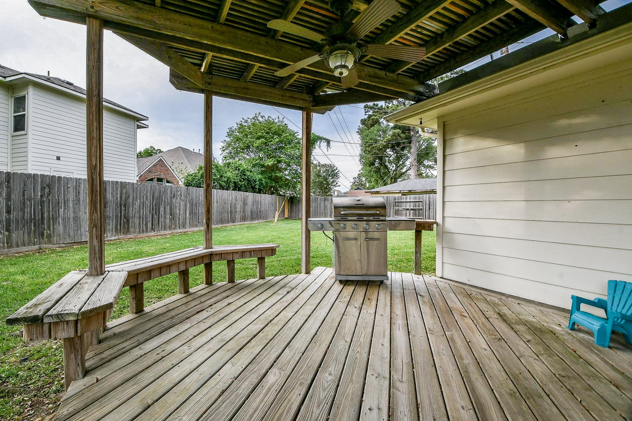 20423 Forest Drive Spring, TX 77388 - Photo 41 of 49 The covered deck has built in seating with additional space to add more furniture.