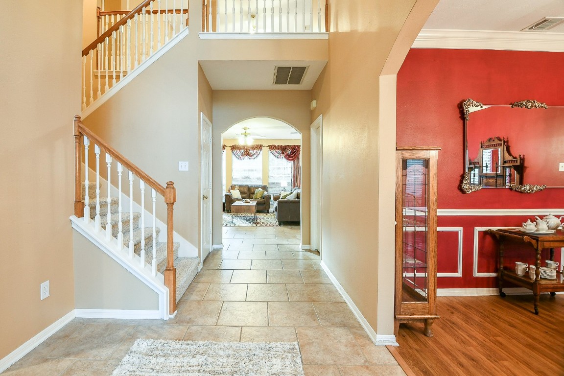 20423 Forest Drive Spring, TX 77388 - Photo 5 of 49 The entry welcomes you with high ceilings, arched doorways, crown molding and a tile entry.