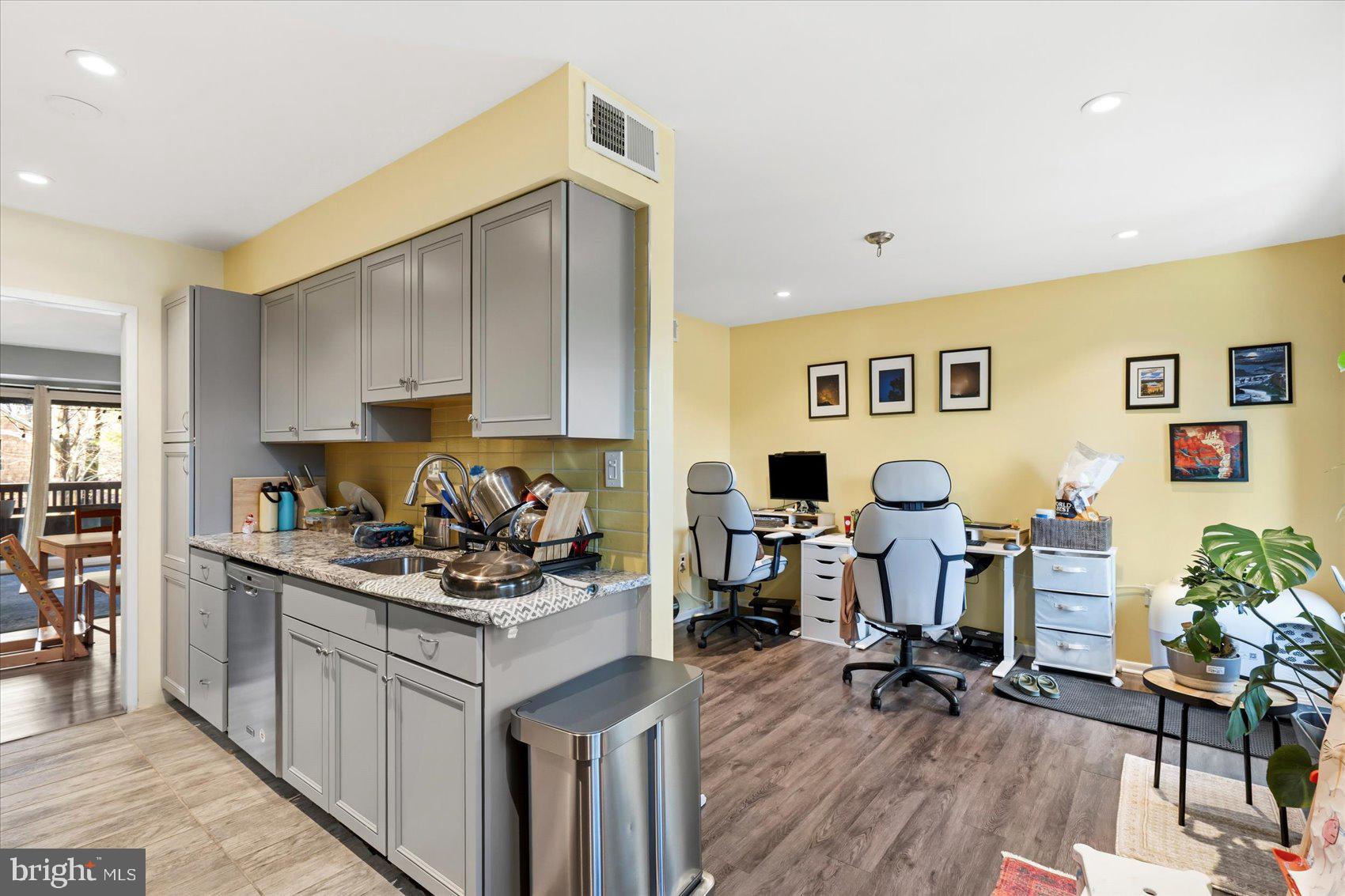 5239 West Running Brook Road, Unit 302 Columbia, MD 21044 - Photo 12 of 33 a living room with furniture and wooden floor