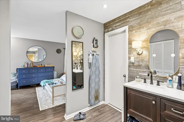 a view of living room kitchen and entryway
