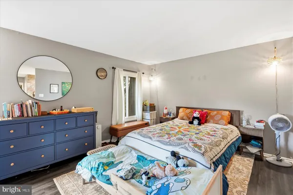 a bed room with a bed and a mirror