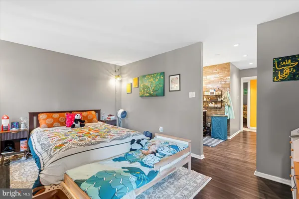 a bedroom with a bed and a table in it