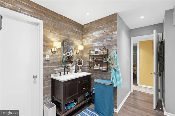 a bathroom with a sink double vanity and a mirror