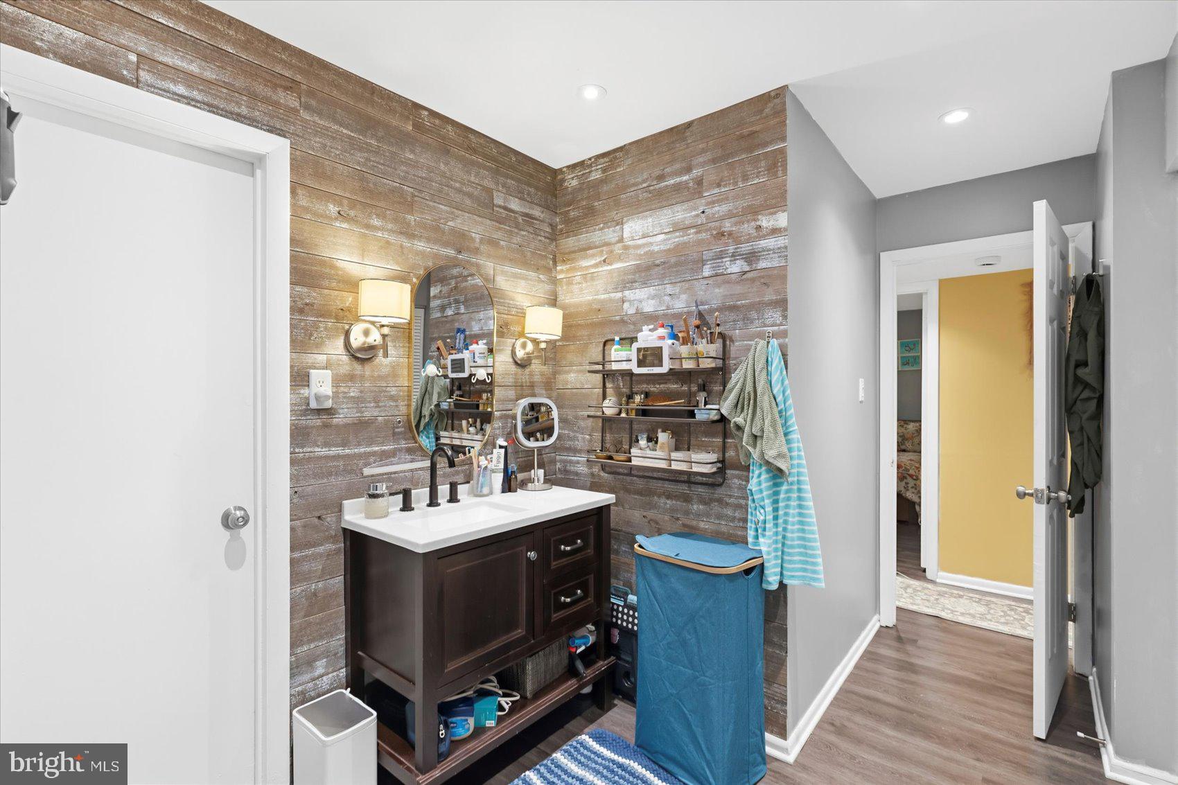 5239 West Running Brook Road, Unit 302 Columbia, MD 21044 - Photo 20 of 33 a bathroom with a sink double vanity and a mirror