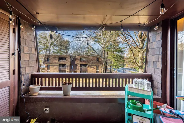 a view of a chair and table in the balcony