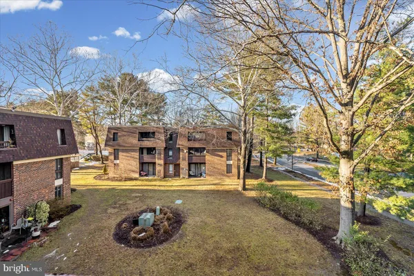 a view of a house with snow on the road